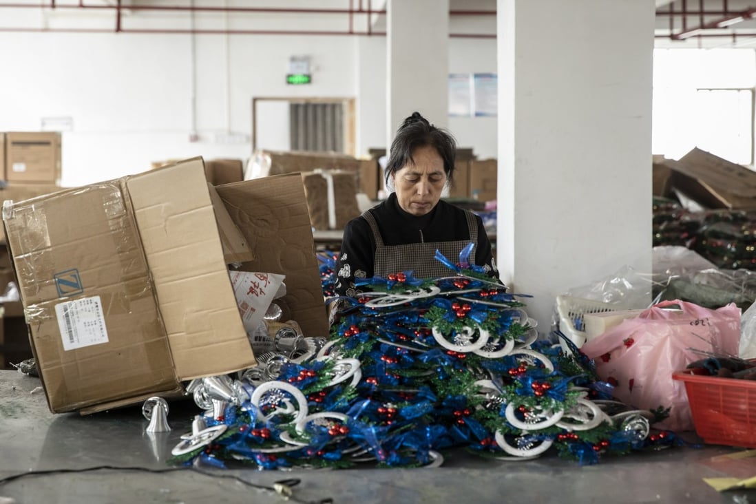 A worker packs Christmas ornaments on the production floor of a factory in Yiwu, China, Oct. 19, 2021. Photo: Bloomberg