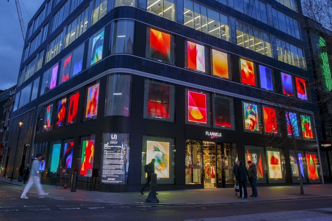 A series of NFT artworks collectively titled ‘MVP Most Valuable Painting’ by artist Jonas Lund is displayed on screens in the windows of The Flannels Group department store on Oxford Street in London on April 4. Photo: Bloomberg