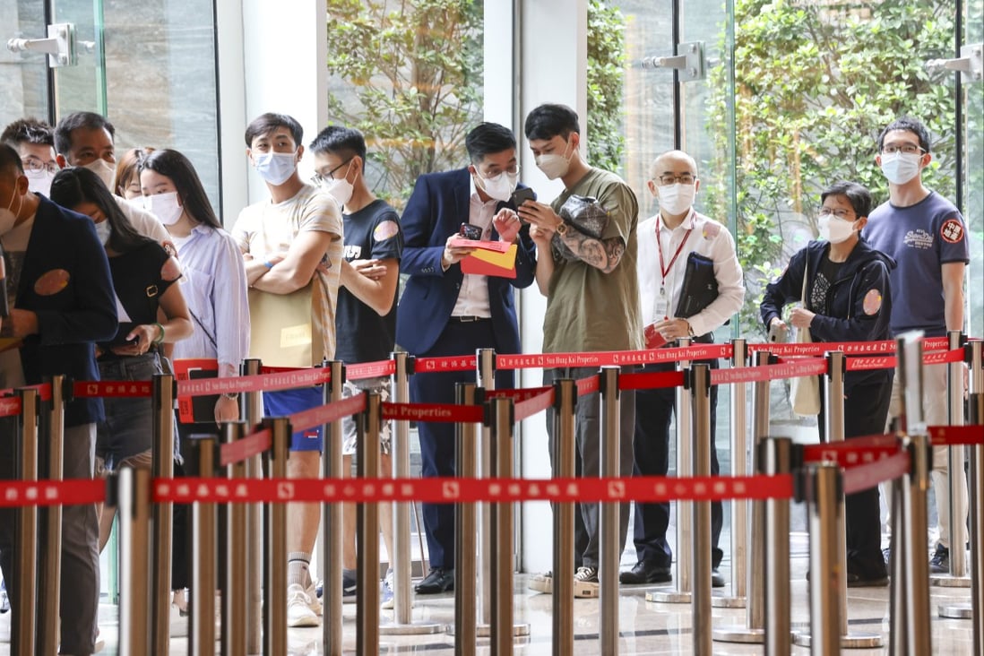 Potential flat buyers queue up outside a sales office in Hong Kong. Photo: Jonathan Wong