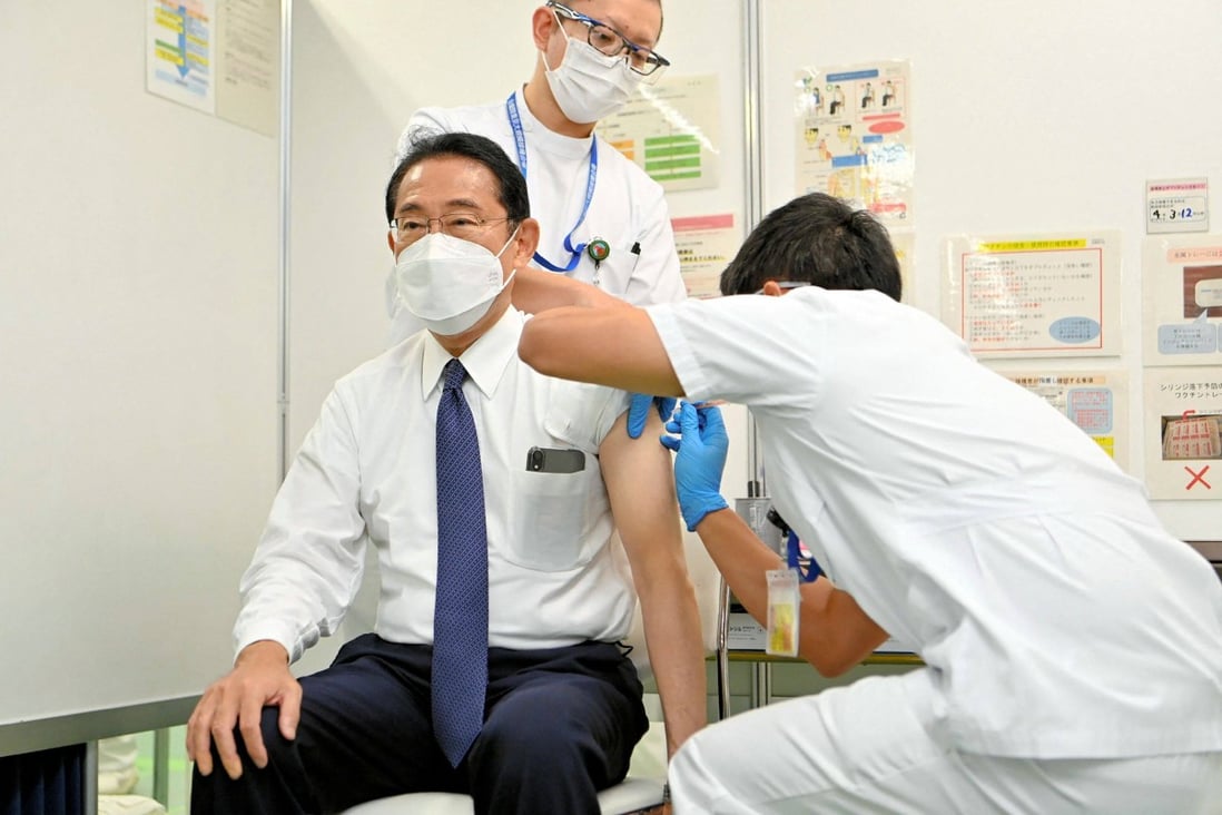 Japan’s Prime Minister Fumio Kishida (left) receiving a fourth dose of Covid-19 vaccine in Tokyo earlier this month. Photo: AFP