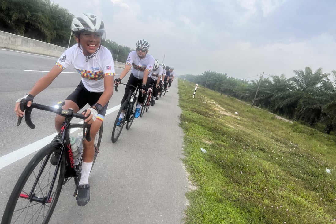 A 14-year-old Malaysian boy with autism, ADHD and a coordination disorder, Uzair cycles hundreds of kilometres a week with friends and supporters. Photo: Ahmad Syauqi Ahmad Said