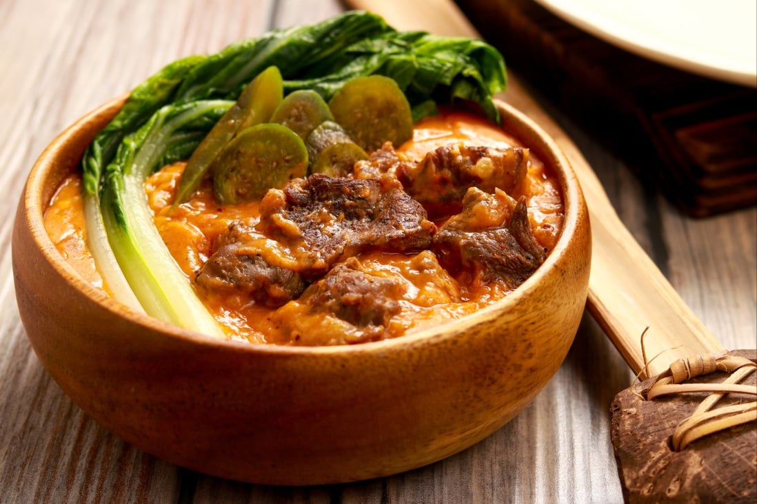 The classic umami Filipino dish kare-kare is a thick, peanutty stew flavoured with bagoong - fermented fish sauce. Chefs around the world use similar sauces to deliver a flavour kick. Photo: Shutterstock