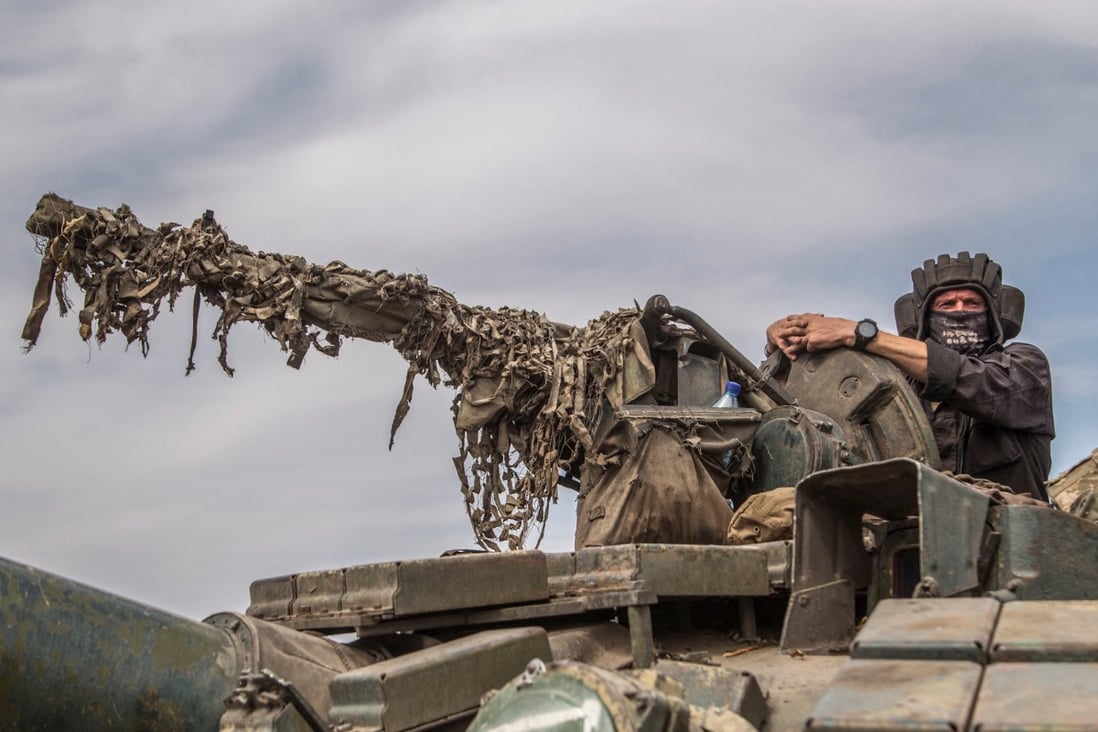 A Ukrainian serviceman rides atop a tank near a front line in Mykolaiv region on August 10, as Russia’s attack on Ukraine continues. Photo: Reuters