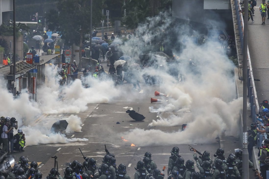 Riot police fire tear gas canisters at protesters on September 29, 2019. Photo: K. Y. Cheng