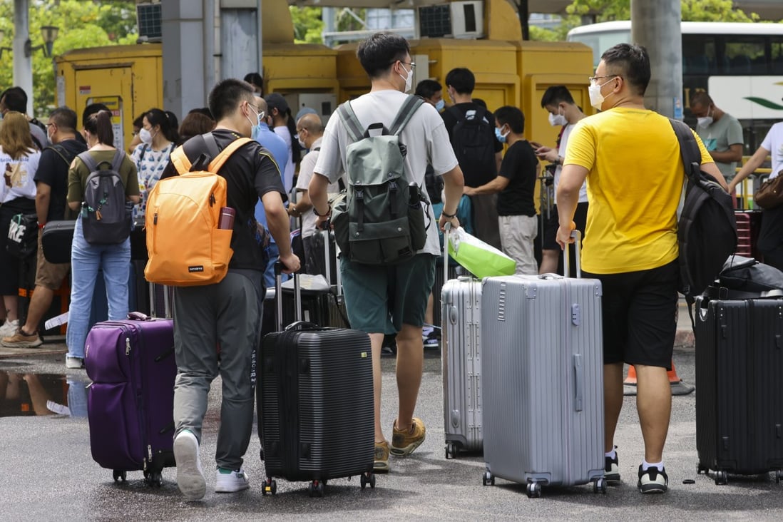 Young people with suitcases at Shenzhen Bay Port in Hong Kong. Photo: Dickson Lee
