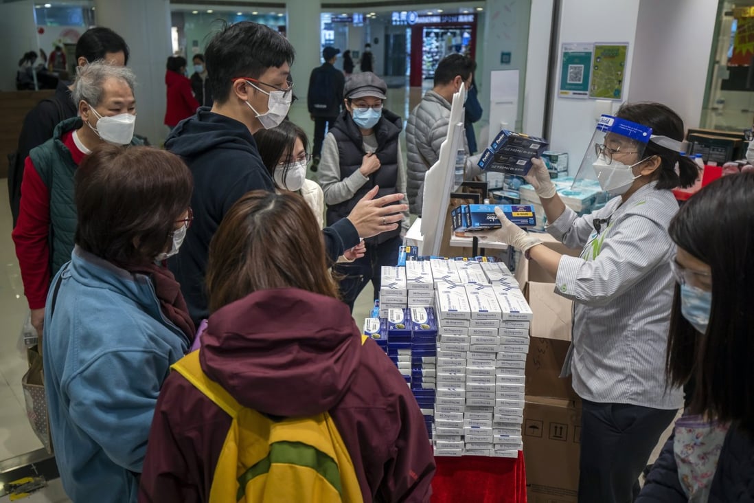 Customers purchase Covid-19 rapid antigen test kits at a store in Hong Kong on February 18. More than half a million RATs are taken every day in Hong Kong, generating more than 3.5 million pieces of plastic from the test kits. Photo: Bloomberg