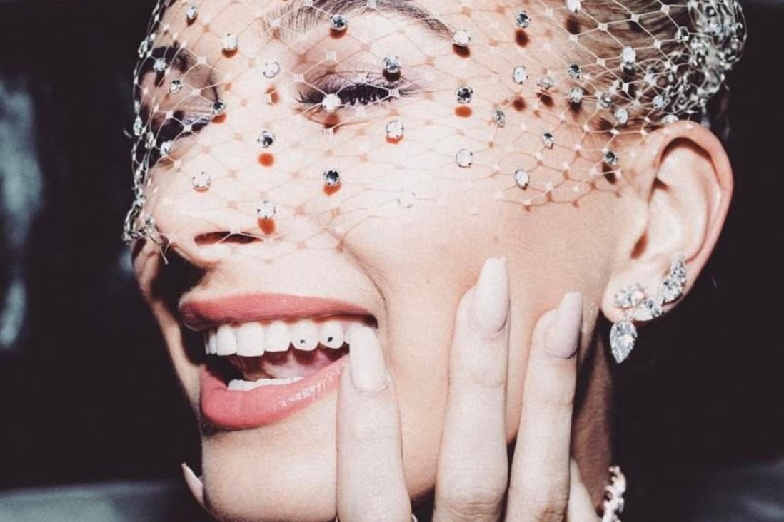 Stick-on gems were popular in the ’90s and ’00s and they’re seeing a revival – on teeth. Celebrities like Hailey Bieber have jumped on board the trend. Photo: Instagram