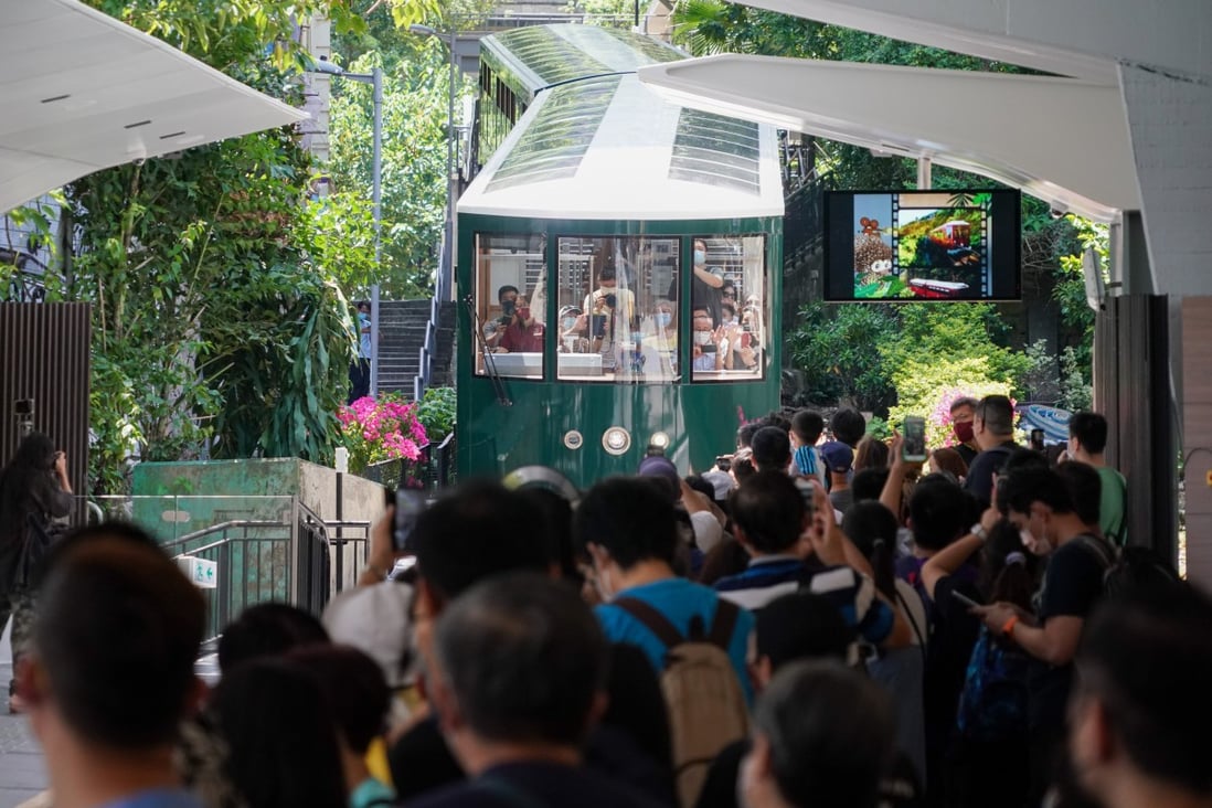 Hundreds of Hongkongers queued to be the first to ride on the new generation Peak Trams when they reopened to the public on Saturday. Photo: Felix Wong