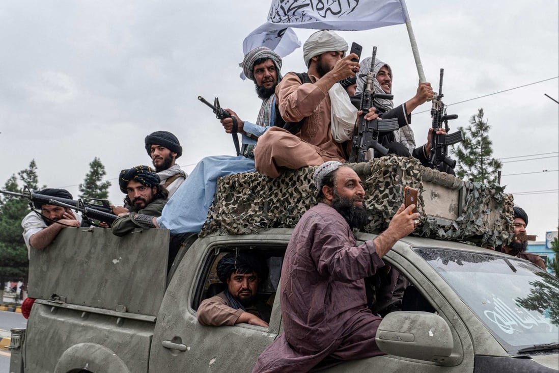 Taliban fighters celebrate near Kabul airport on August 15, the first anniversary of their return to power in Afghanistan. Photo: AFP