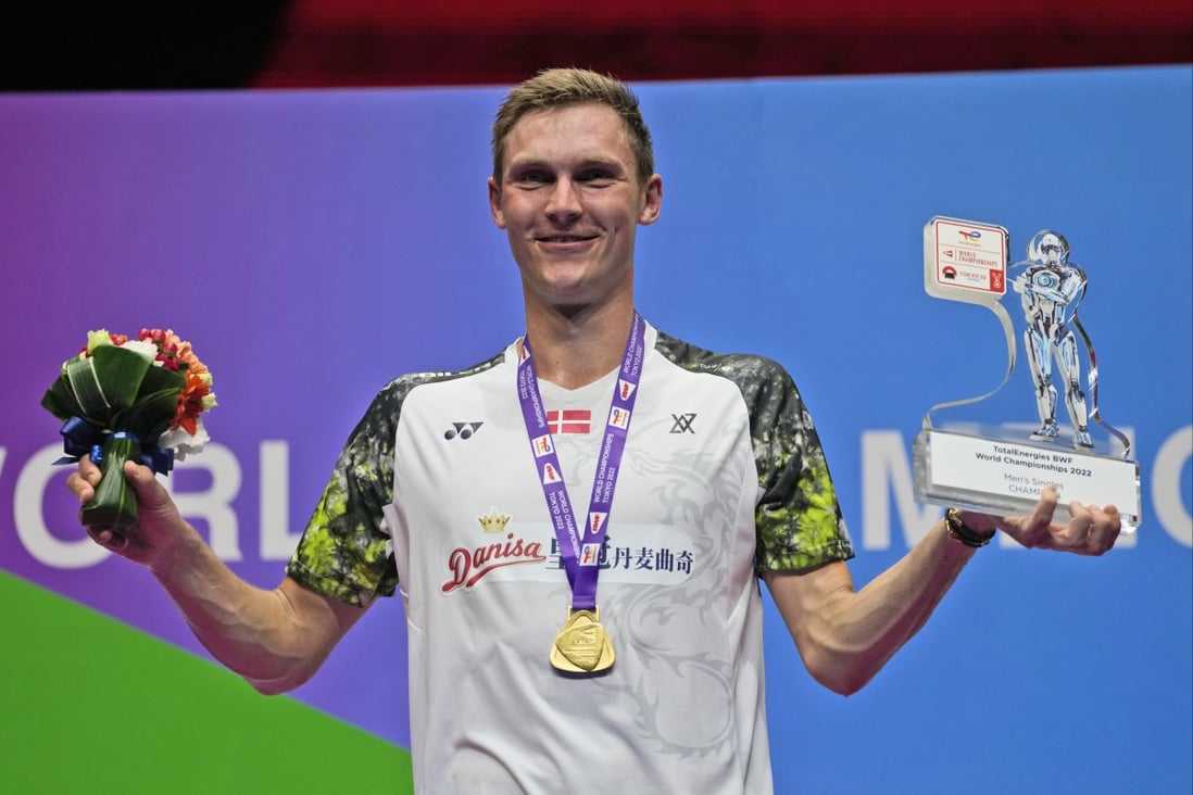 Denmark’s Viktor Axelsen celebrates on the podium with his trophy and gold medal following his victory over Thailand’s Kunlavut Vitidsarn in their men’s singles final at the BWF World Championships in Tokyo. Photo: AP