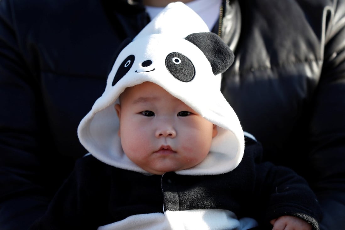A 6-month-old baby wears a giant panda costume at a zoo in Tokyo. The nursing home in Kitakyushu has signed up more than 30 babies so far. Photo: Reuters