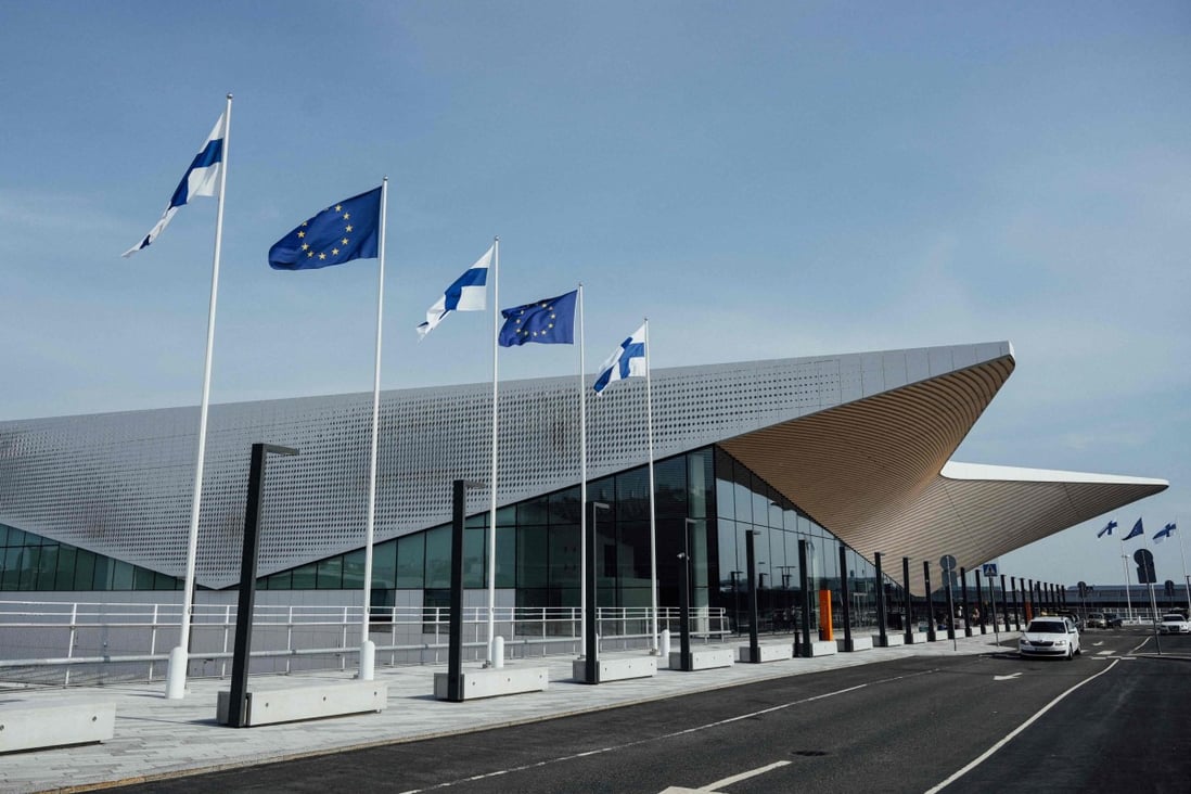 Finnish and EU flags wave outside Helsinki airport in Vantaa, Finland. More than 1 million Russian citizens have entered the bloc through land border crossing points since the beginning of the Ukraine invasion, most of them via Finland and Estonia. Photo: AFP