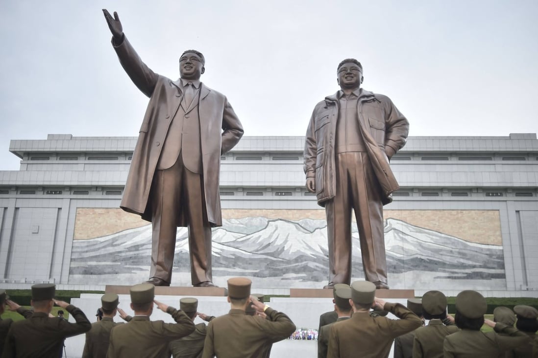 Korean People’s Army (KPA) personnel pay their respects before the statues of late North Korean leaders Kim Il-sung and Kim Jong-il in Pyongyang. Photo: AFP