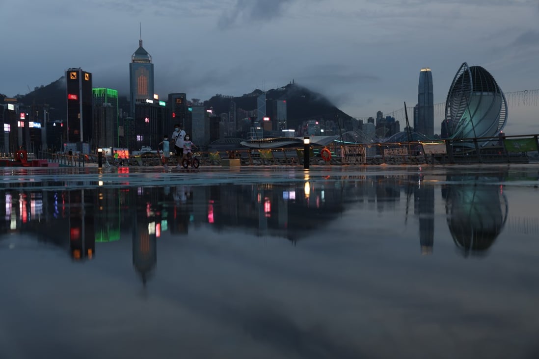 Commercial and residential buildings on Hong Kong island are reflected on the ground at East Coast Park Precinct in Causeway Bay.  Photo: Yik Yeung-man