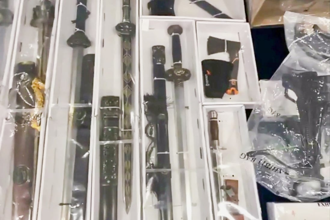 A Facebook photo of the police display of the stash of weapons found in the suspect’s home in March. 