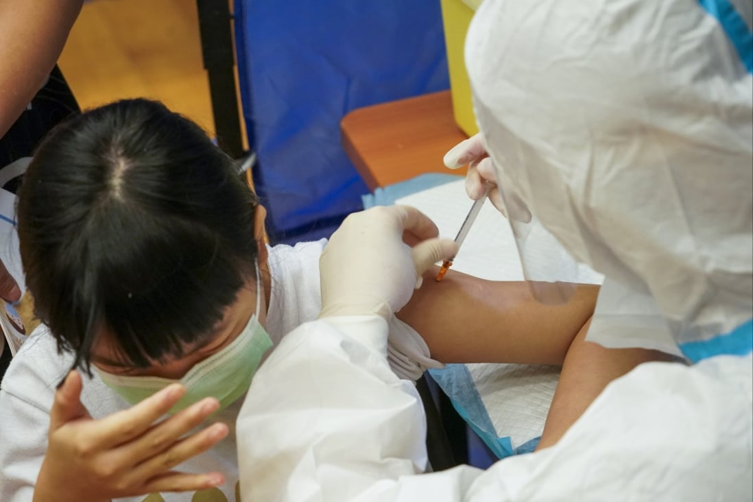 A child is vaccinated against Covid-19 at a centre in Ngau Chi Wan on August 28.
Photo: Felix Wong