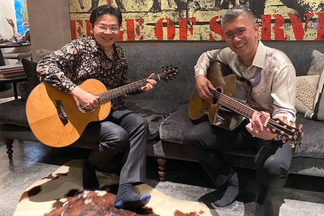 Lawrence Wong and Malaysian finance minister Tengku Zafrul Abdul Aziz strum guitars after a private dinner on September 4, 2022. Photo: Handout