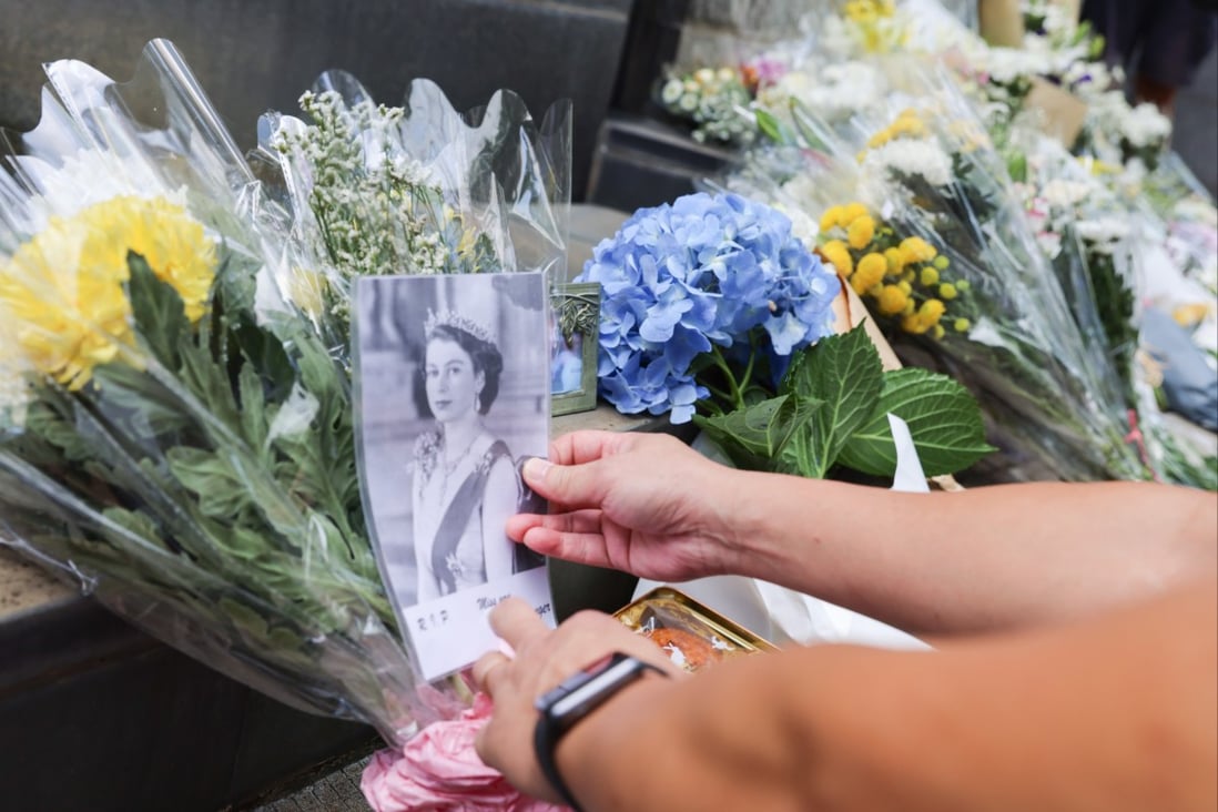 People leave floral tributes outside the British Consulate-General in Hong Kong after hearing the news of Queen Elizabeth’s death. Photo: Dickson Lee