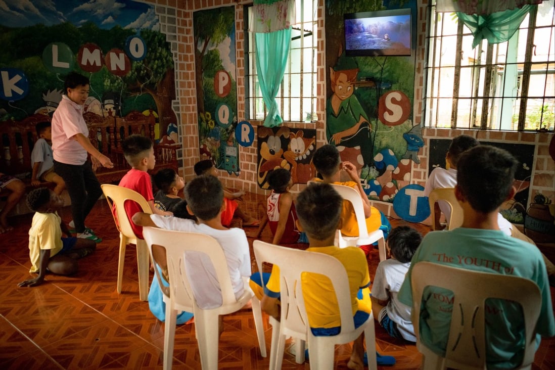 Children at the boys’ dormitory in Nayon ng Kabataan watch TV in the common area. The government-run facility in Mandaluyong City in the Philippines serves abandoned, neglected and orphaned children aged 7-17. Photo: Bernice Beltran