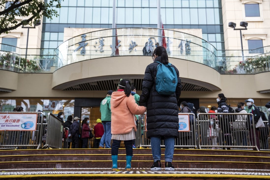 Residents queue outside a community vaccination centre in Hong Kong on February 23. Photo: Bloomberg