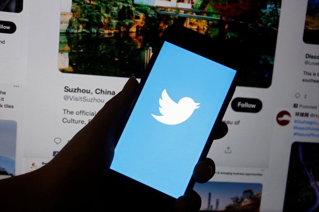 A Twitter logo is displayed on a mobile phone near a computer screen showing promoted tweets on China. Photo illustration: Reuters