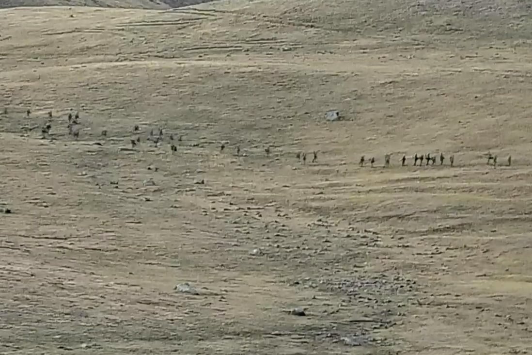 This image taken from a YouTube footage released by Armenian Defence Ministry on Tuesday, shows Azerbaijanian servicemen crossing the Armenian-Azerbaijani border and approaching the Armenian positions. Photo: AP
