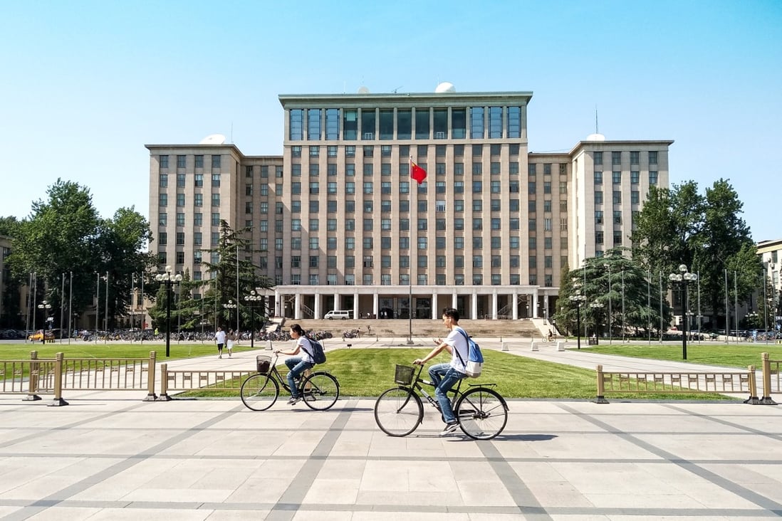 Students cycling in front of the main entrance of the prestigious Tsinghua University in Beijing, China. Photo: 
Shutterstock 