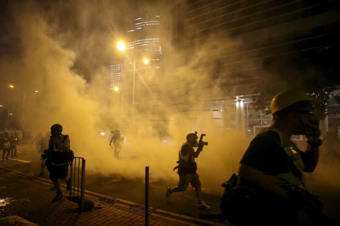 Riot police clash with protesters outside the Legislative Council Building in Hong Kong in July 2019. Photo: Winson Wong