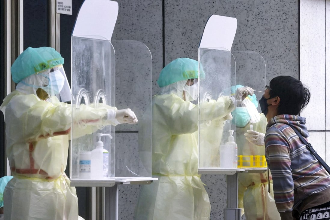 Covid-19 tests are conducted in Taipei, May 24. Taiwanese health authorities say the next two weeks will determine if mandatory quarantine for all arrivals can be ended. Photo: Reuters