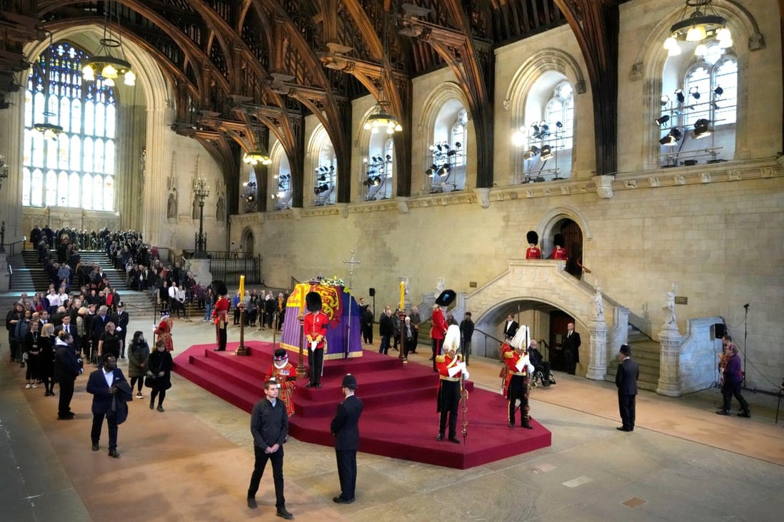 Members of the public file past the coffin of Queen Elizabeth lying in state in Westminster Hall  ahead of her funeral on Monday. Photo: Reuters