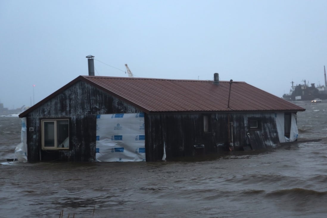 A home is seen floating in the Snake River near Nome, Alaska, on Saturday. Much of Alaska’s western coast could see flooding and high winds as the remnants of Typhoon Merbok moved into the Bering Sea region. Photo: AP