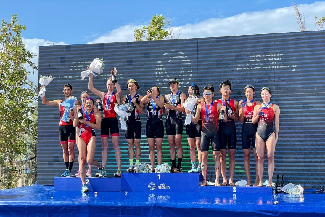Hong Kong’s triathletes (left) celebrate their silver medal win in the mixed relay at the Asia Championships. Photo: Hong Kong Triathlon Association