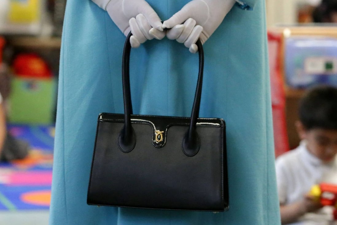 Hundreds of Queen Elizabeth’s favourite brands, including Launer handbags (pictured), face losing the seal that marks them as preferred suppliers to the sovereign, unless they gain the approval of King Charles. Photo: AFP