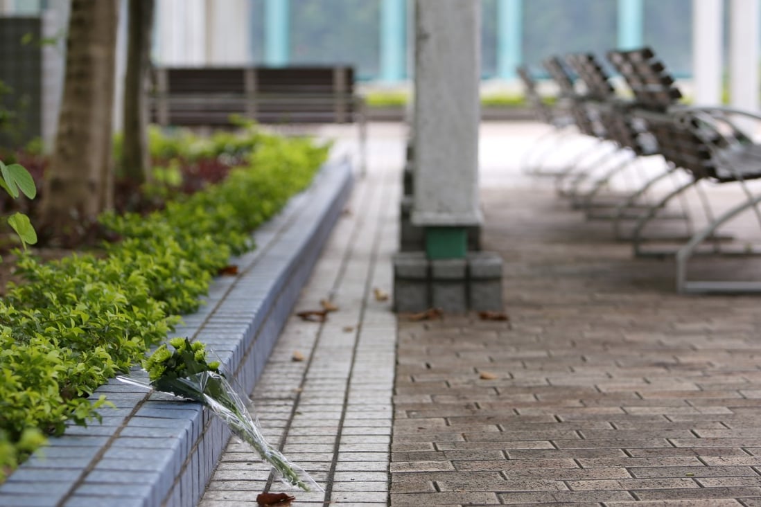 Flowers were left for the victims of a shooting at Quarry Bay Park in 2018. The murderer has been charged for attempting to bribe a prison official. Photo: Xiaomei Chen