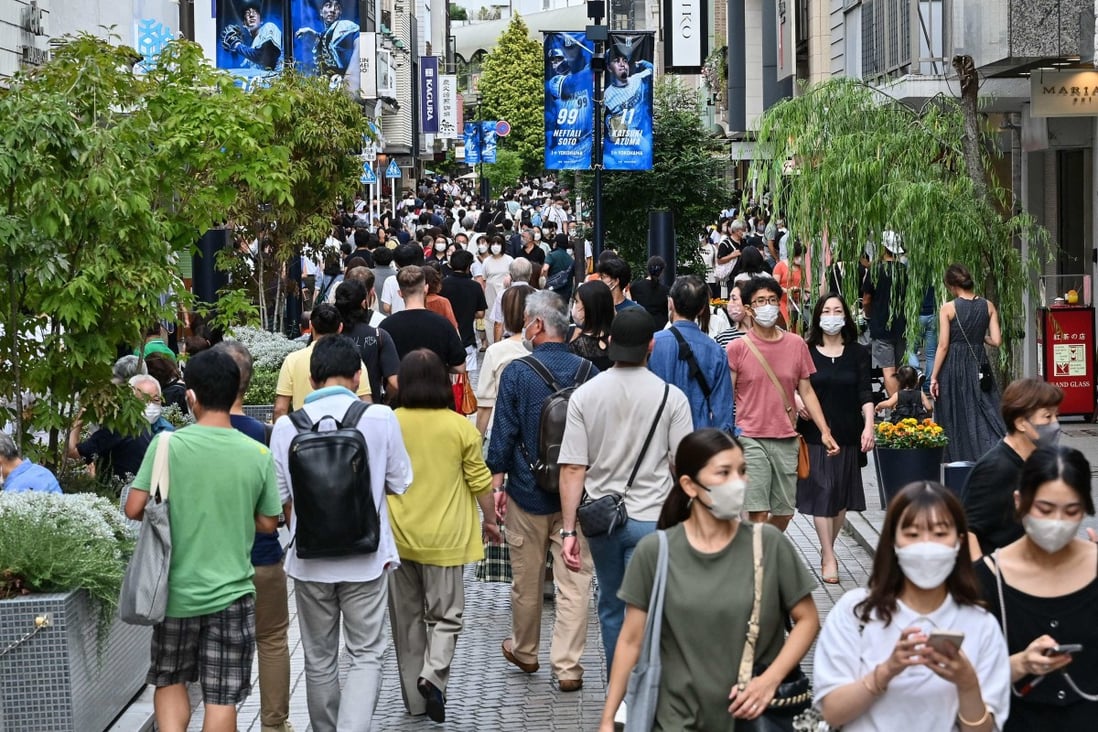 Shoppers walk along a street lined with shops in Yokohama, south of Tokyo. Japan’s inflation has quickened to its fastest rate in more than 30 years. Photo: AFP