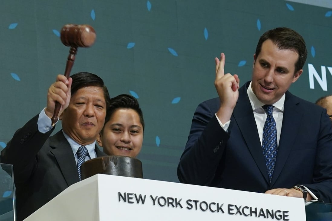 Philippine President Ferdinand Marcos Jnr with a gavel, poised to ring the bell at the New York Stock Exchange on Monday. Photo: AP