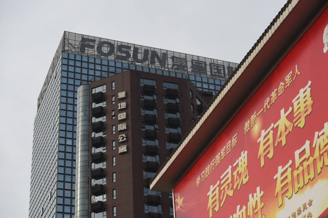 The logo of Chinese conglomerate Fosun seen on top of a building in Beijing. Photo: AFP