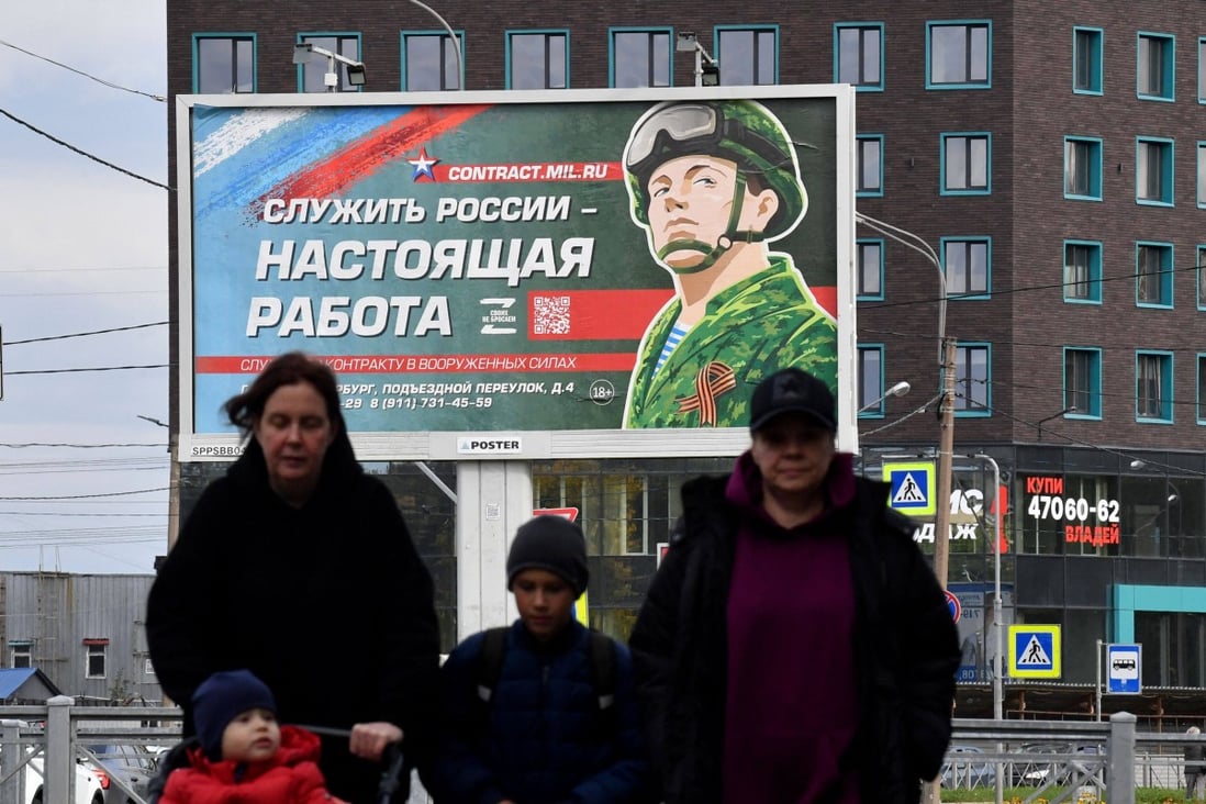 A hoarding promoting contract army service displayed in Saint Petersburg, Russia. Photo: AFP
