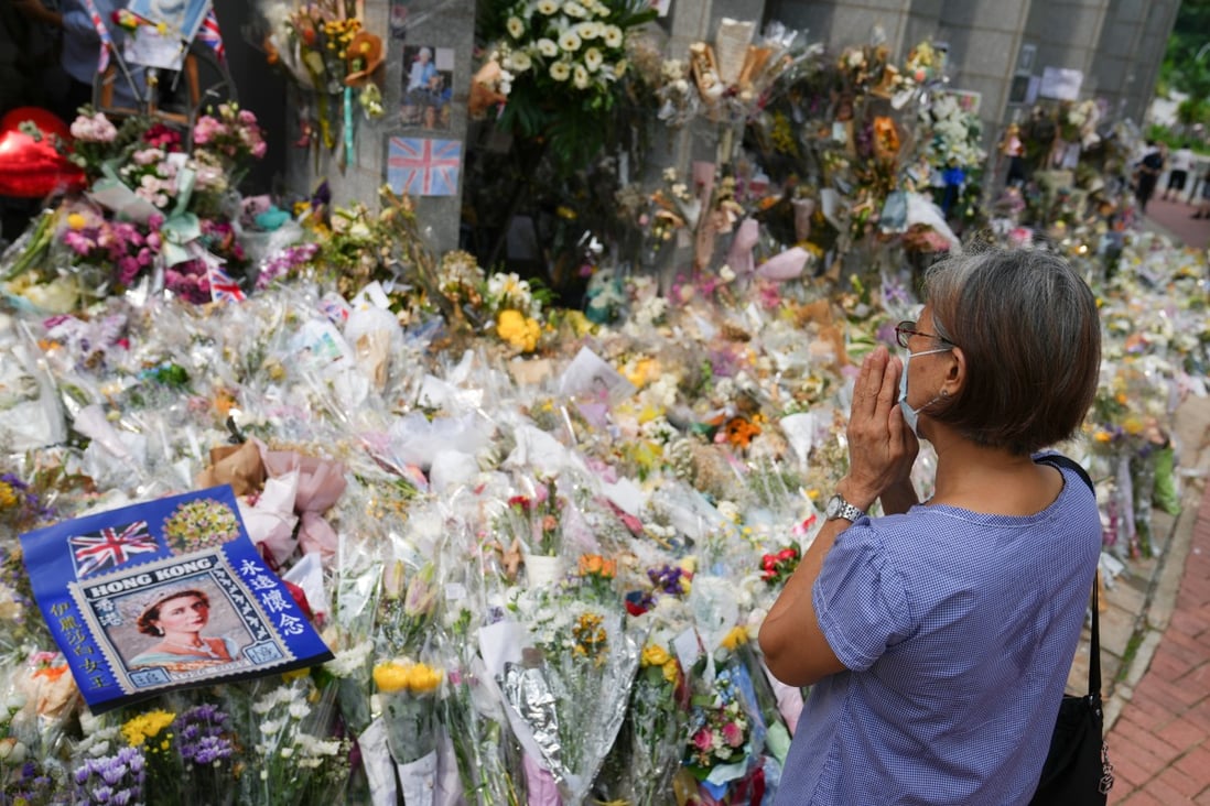 People leave floral tributes to “boss lady” Queen Elizabeth outside the British consulate in Admiralty, Hong Kong, on September 19. Photo: Sam Tsang