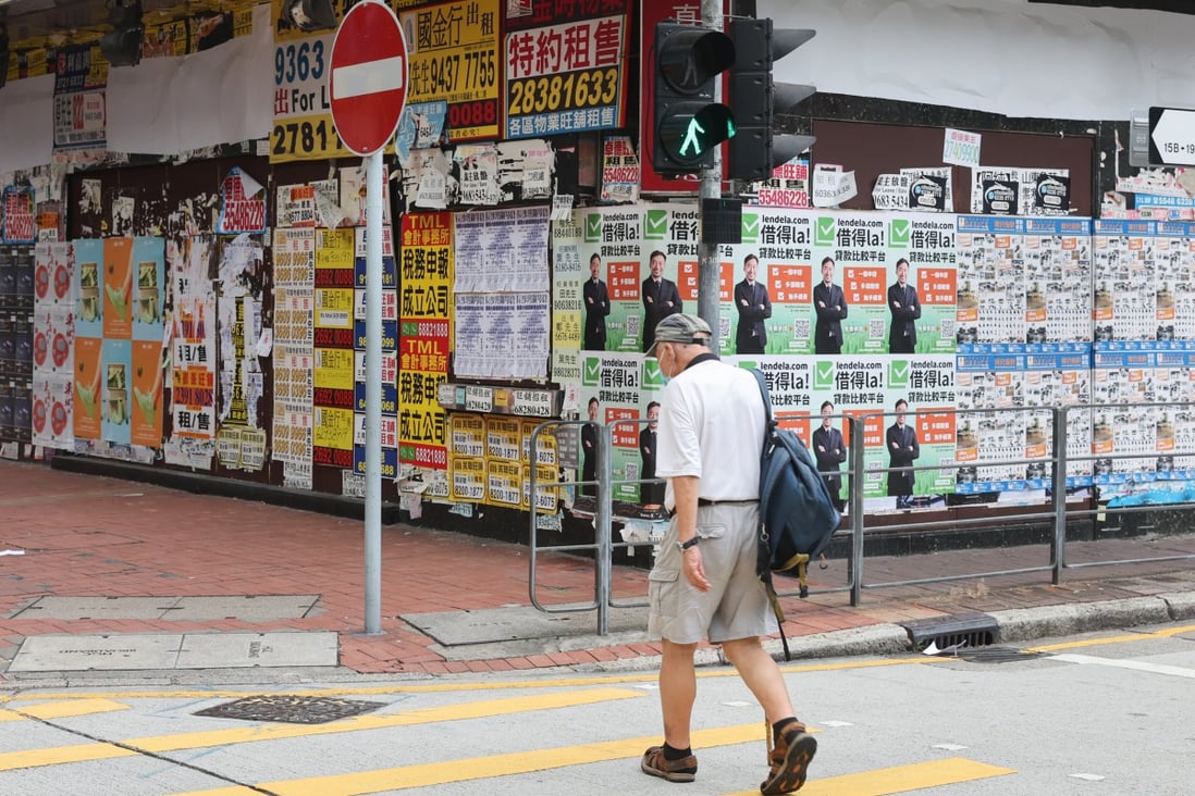 A man walks past closed retail shops in Mong Kok on September 19, 2022. The shop vacancy rate stood at 11.2 per cent in July and August, according to Midland ICI. Photo: Edmond So