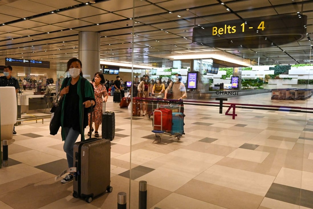 Passengers arrive at the reopened Changi Airport terminal 4 in Singapore. Photo: AFP