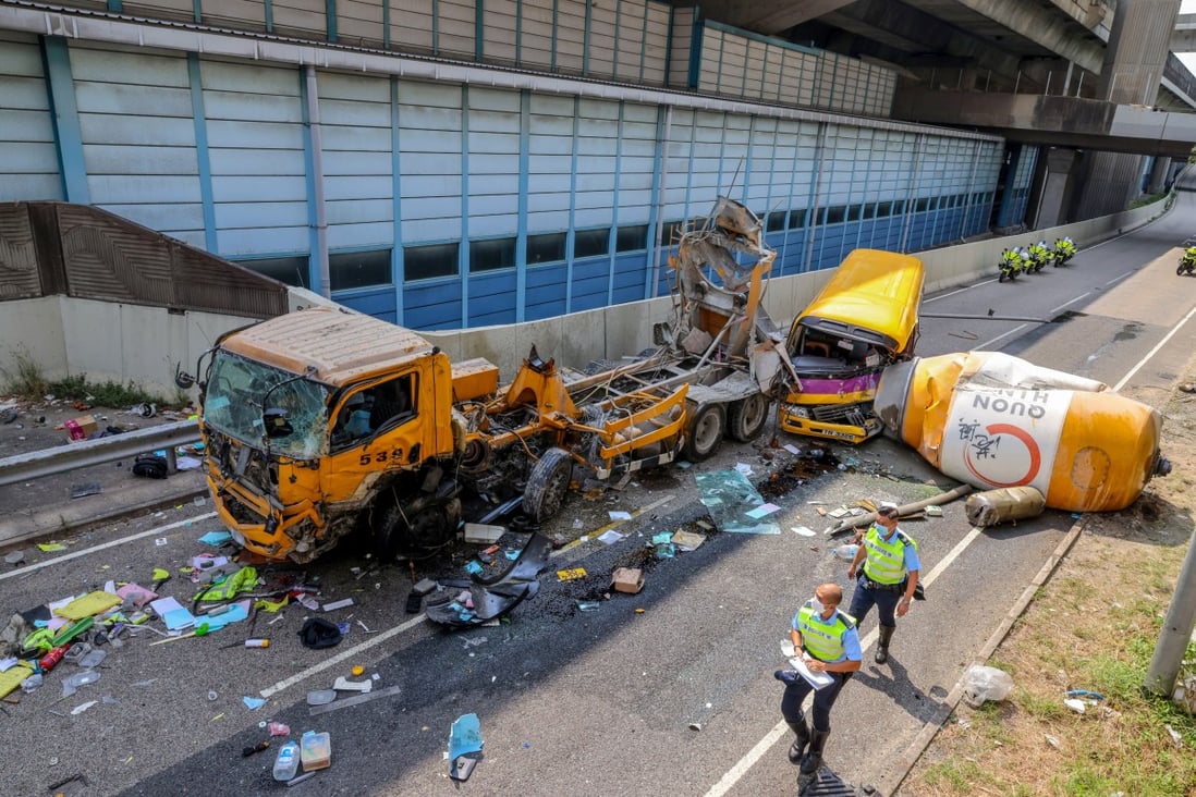 A cement mixer fell off a flyover and hit a school bus in Cheung Sha Wan. The truck driver died and four others were injured in the incident. Photo: Dickson Lee