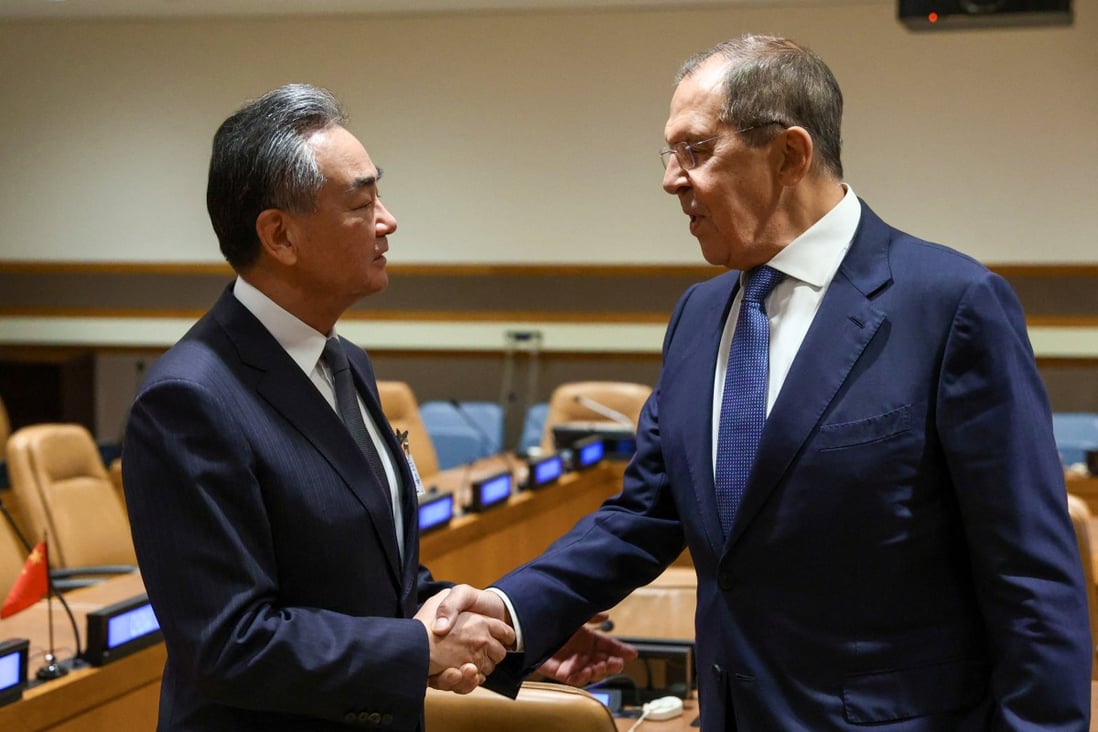 Wang Yi and Sergey Lavrov shake hands ahead of their meeting at the UN in New York. Photo: Reuters