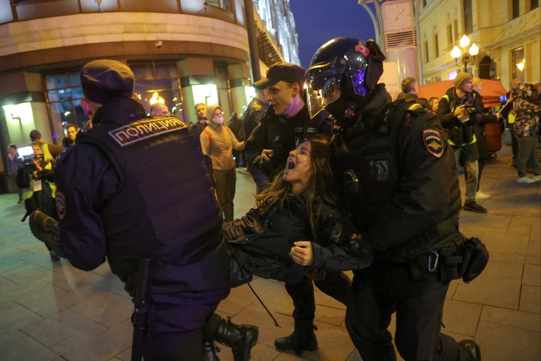 Russian police officers detain a protester during a rally in Moscow on Wednesday. Photo: Reuters