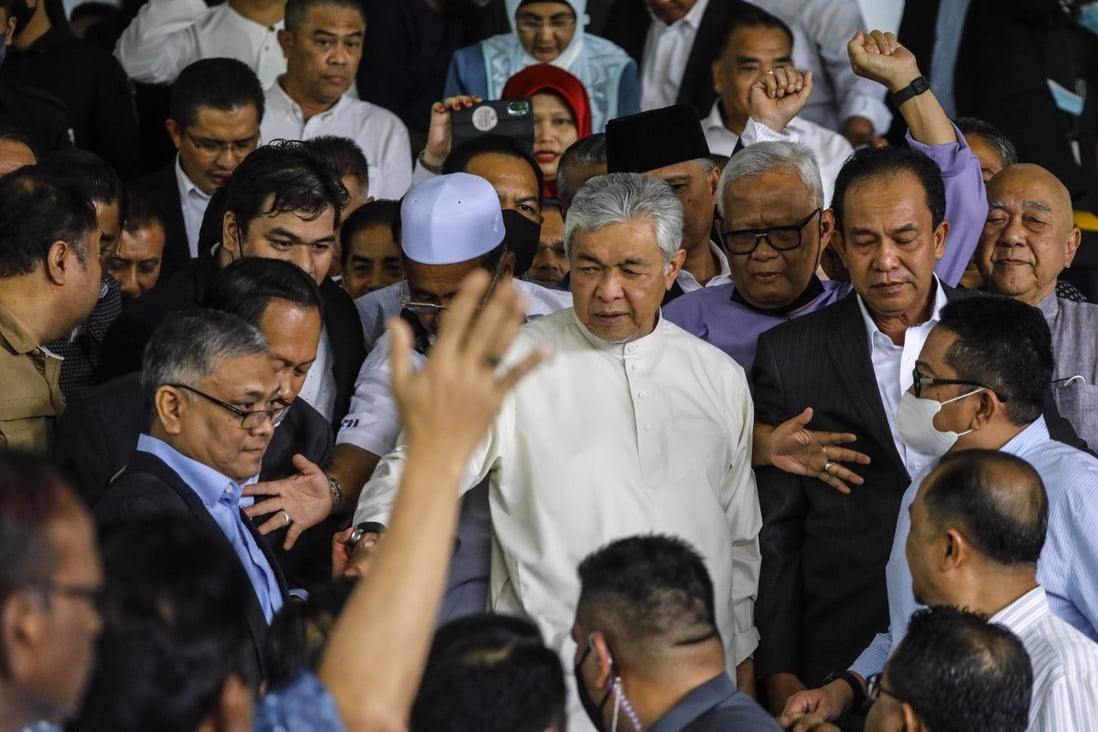 Zahid (centre) is part of a wider group of Umno politicians facing criminal cases that is often referred to as the “Kluster Mahkamah”, the court cluster, by local media. Photo: EPA-EFE