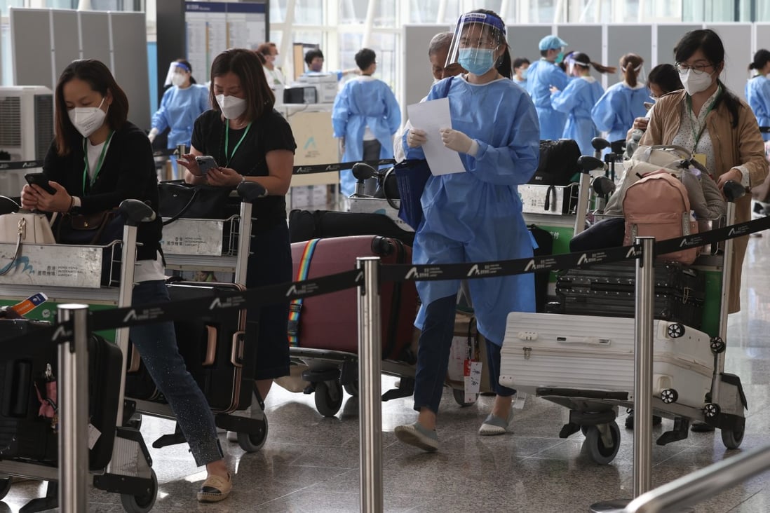 Passengers arrive in Hong Kong while the government announces the quarantine policy will change next week. Photo: K. Y. Cheng