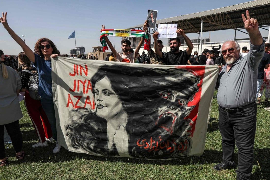 A banner with the image of 22-year-old Mahsa Amini during a demonstration denouncing her death outside the UN offices in Erbil, the capital of Iraq’s autonomous Kurdistan region, on Saturday. Photo: AFP