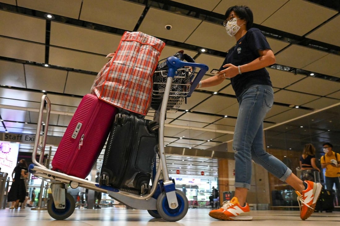 Passengers arrive from their flight at the reopened Changi International Airport Terminal 4 in Singapore on September 13, following its closure for more than two years due to the pandemic. Photo: AFP