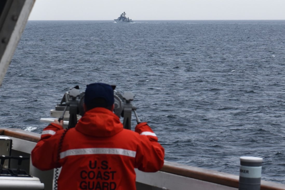 A crew member of the US Coast Guard cutter Kimball observes a vessel in the Bering Sea on September 19. Photo: US Coast Guard District 17
