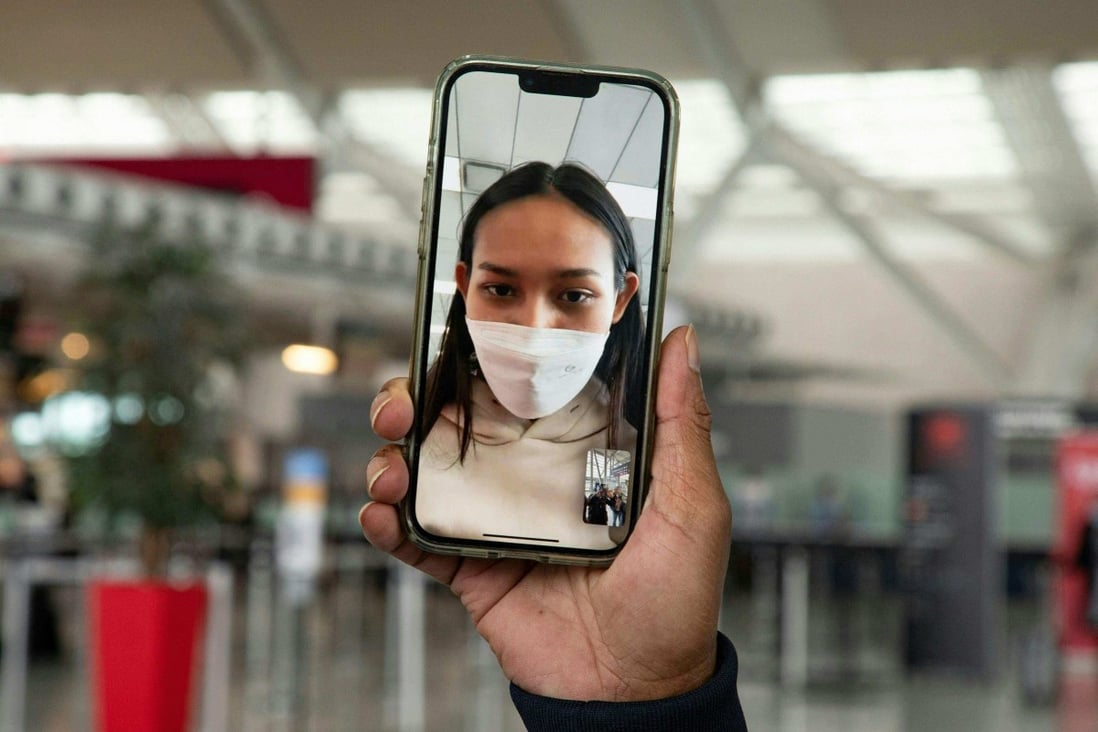 Myanmar beauty queen Han Lay speaks by video call during her arrival at Toronto Pearson International Aiport on Wednesday while she waits for a connecting flight. Photo: AFP